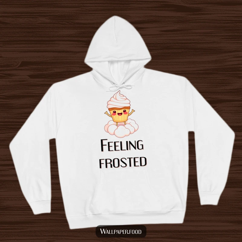 Funny hoodie featuring a happy cupcake character bouncing on a cloud of whipped cream, offering a warm and joyful embrace.