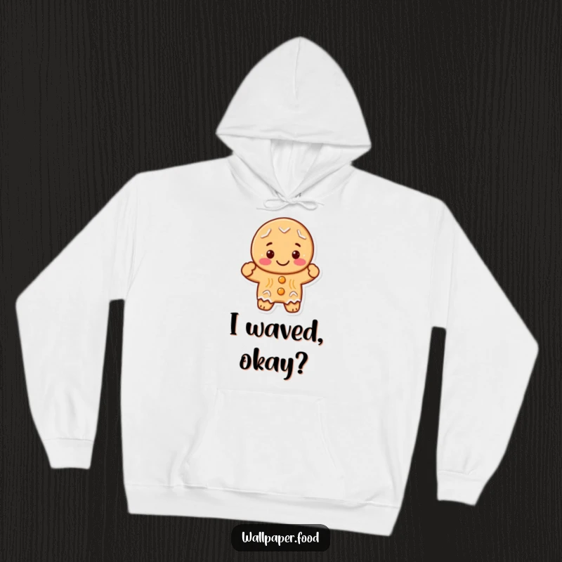 Funny, cute gingerbread cookie character joyfully waving a hand, designed for ultimate comfort on a soft hoodie.