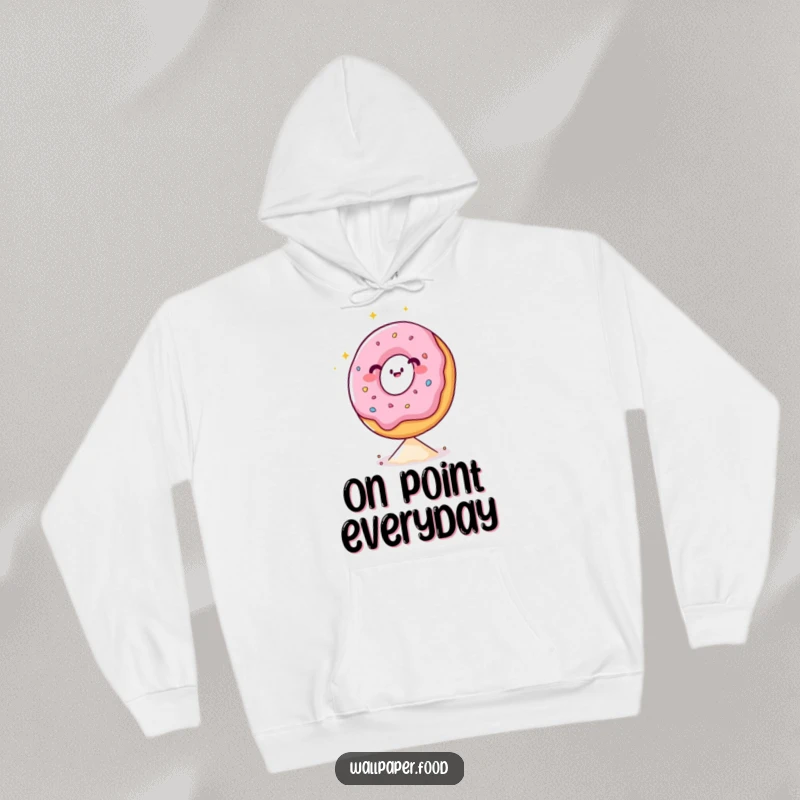 Funny hoodie depicting a happy donut character with a sparkling demeanor, demonstrating impressive balance on a single sprinkle.