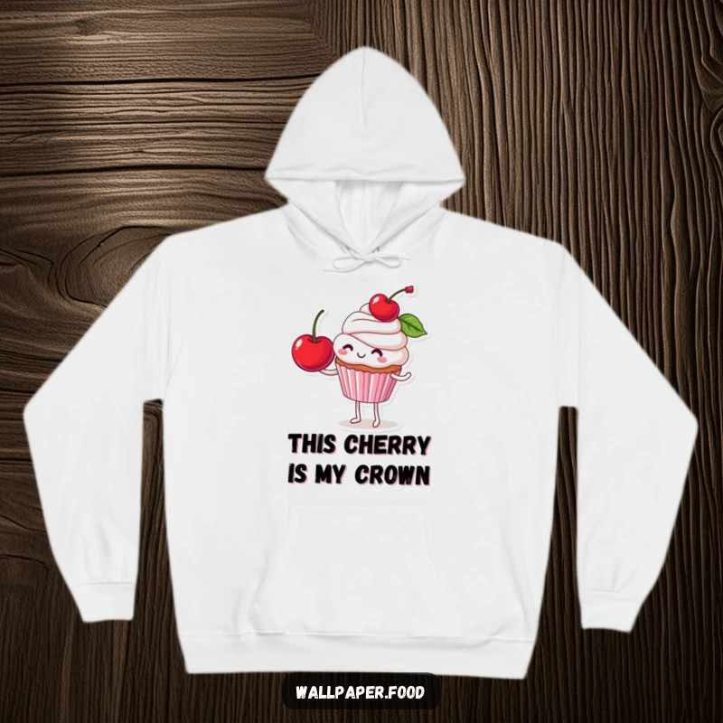 Funny hoodie depicting a smiling cupcake character with a giant cherry wobbling on its head, bringing a smile and warmth.