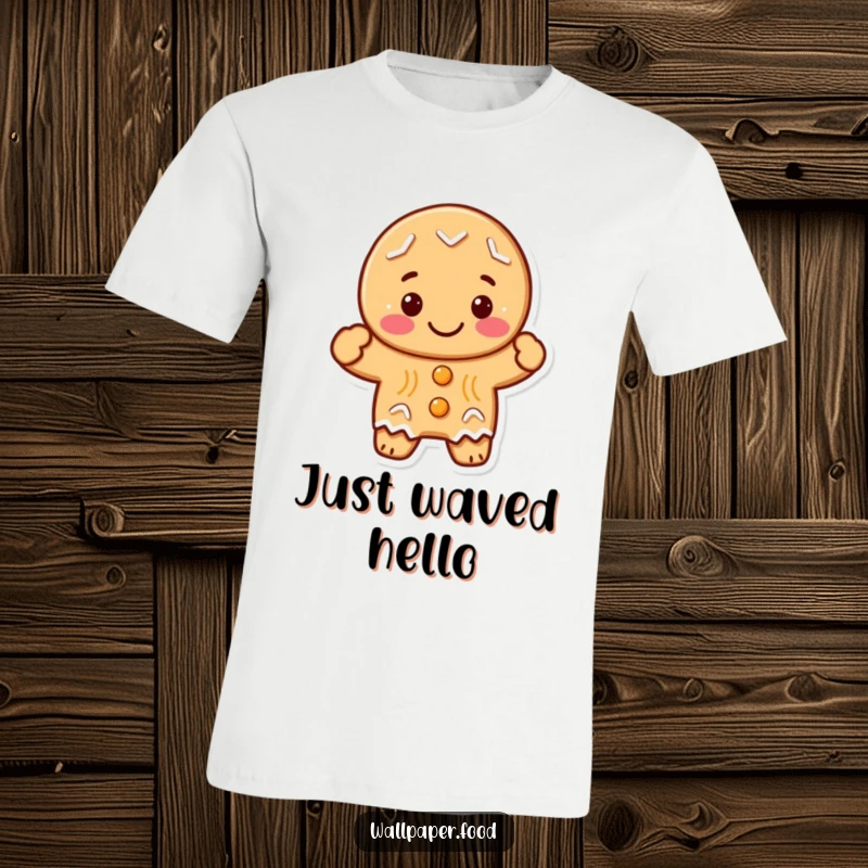 Funny gingerbread man character with a wide grin, enthusiastically waving hello, printed on a comfortable t-shirt for festive fun.